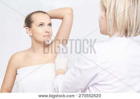 Unwanted Hair Wax Epilation. Young Woman. Cosmetology Salon Treatment Procedure. Home Waxing
