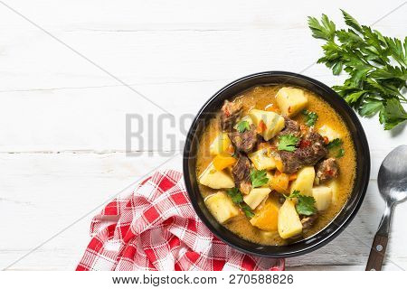 Goulash With Meat And Vegetables On White Wooden Table. Beef Stew With Vegetables. Top View With Cop