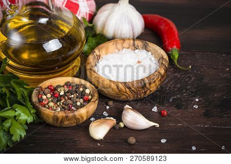 Ingredients For Cooking On Wooden Background. Spices, Herbs And Oil.