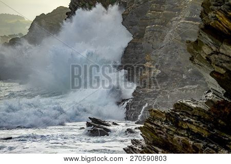 Sea Waves Breaking On The Coast Cliffs In Barrika