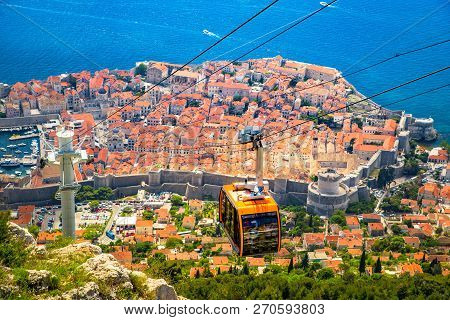 Aerial Panoramic View Of The Old Town Of Dubrovnik With Famous Cable Car On Srd Mountain On A Sunny 
