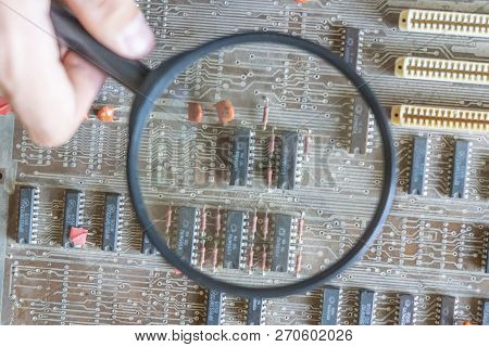Micro Or Nano Electronic Board Reapir Concept, Hand Hold Magnifying Glass
