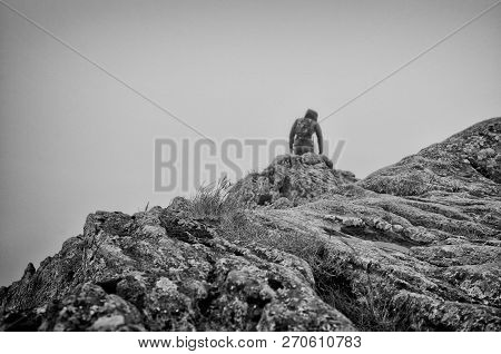 Black And White Of Man In The Cloud On Striding Edge, Helvellyn, Lake District, England, Uk