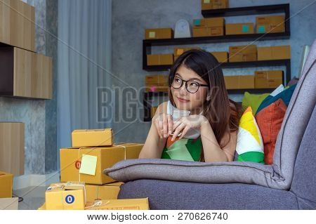 Young Asian Teenager Owner Business Woman Work At Home For Online Shopping, Checking Order And Prepa