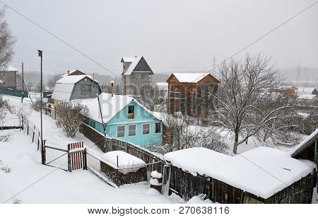 Summer Houses On Suburban Garden Plots In The Village Overcast Winter Day In The Snow