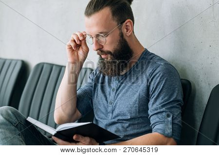 Man Thinking Over His Notes. Contemplation Planning And Brainwork.