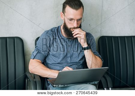 Man Reading Information From Laptop. Thinking Contemplating And Brainwork.