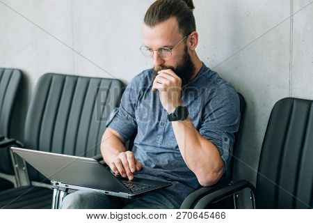 Man Reading Information From Laptop. Thinking Contemplating And Brainwork.