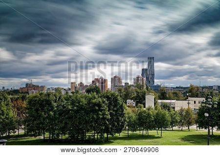 View Of Moscow From High. Summer Day, Overcast Sky And Clouds. Long Exposure. View Of Modern Buildin