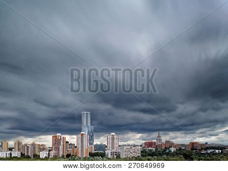 View Of Moscow From High. Summer Day, Overcast Sky And Clouds. Long Exposure. View Of Modern Buildin
