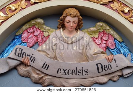 STITAR, CROATIA - NOVEMBER 30: Angel with Gloria in excelsis Deo Banner, Nativity Scene, altarpiece in the church of Saint Matthew in Stitar, Croatia on November 30, 2017.