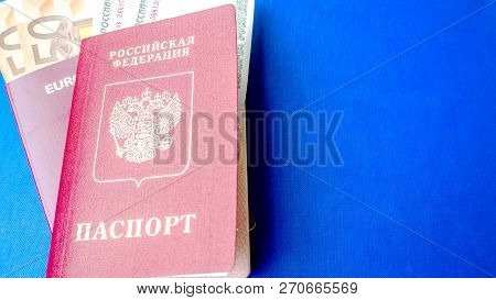 Passports On The Blue Background. Citizenship Of Estonia And Russia. Citizenship Of European Union (