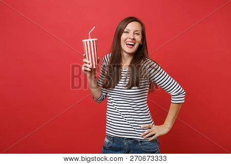 Portrait Of Laughing Young Woman In Casual Striped Clothes Holdi