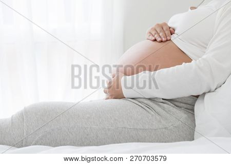 Strain Of Abdominal Muscles During Pregnancy, Preterm Labor And Pregnant Women Health Concept