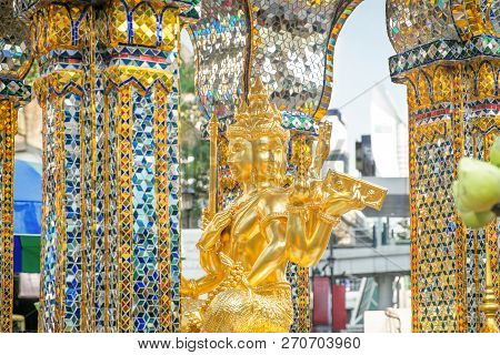 Golden Statue Of Four-faced Thao Maha Phrom At The Erawan Shrine. Bangkok, Thailand.