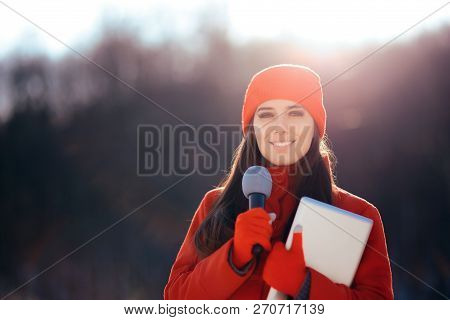 Winter Tv Reporter Broadcasting Outdoors In The Snow