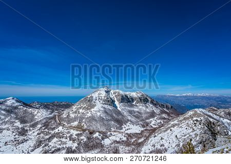 Stunning Mountain Winter Landscape Panorama Of Stirovnik Peak, The Highest Summit Of The Lovcen Nati