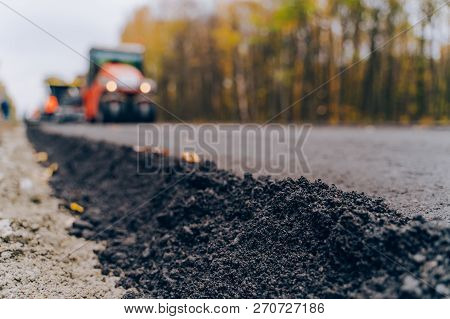 Close View On The New Road Construction Site. Close-up Asphalt At The Road Under Construction. Aspha