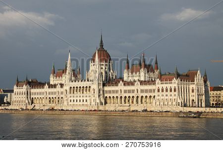 Old Hungarian Parlament, River And Blue Sky