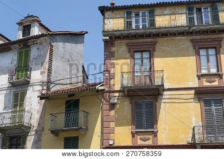 Saluzzo, Cuneo, Piedmont, Italy: Historic Buildings Along The Main Street Of The City.