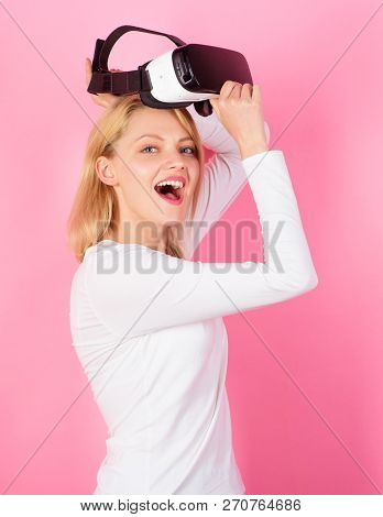 Woman Using Virtual Reality Headset. Pretty Woman Playing Game In Virtual Reality Glasses. Cheerful 