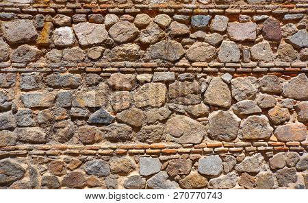 Toledo Juderia stonewall masonry wall texture in Spain