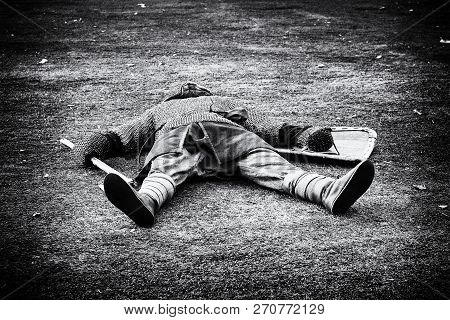 Defeated Medieval Warrior Lying Dead On The Green Grass