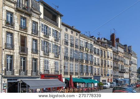 Nive River Embankment With Historical Houses In Bayonne, France