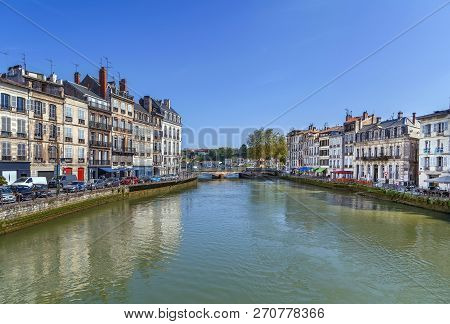 Nive River Embankment With Historical Houses In Bayonne, France