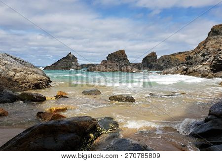 High Tide On A Wavy, Stony Beach In Summer Time