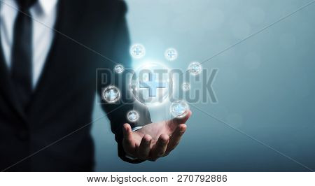 Businessman Hand Holding Bubble Plus Sign Means To Offer Positive Thing (like Benefits, Personal Dev