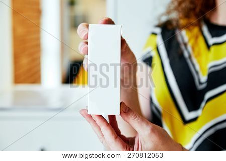 A Girl Holds In The Cookies Box