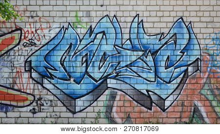 Full And Acomplished Graffiti Artwork. The Old Wall Decorated With Paint Stains In The Style Of Stre