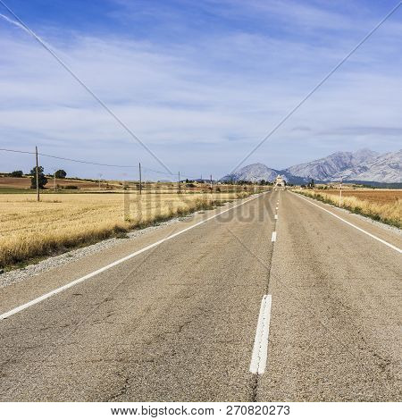 Stright Road Leading To The Inviting Church In Spain. Religious Concept
