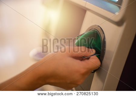 Close Up Woman Is  Hand, Using Card With Cash Machine, Atm Banking Located In Front Of The Bank.