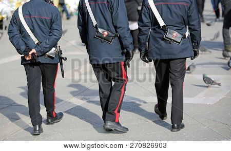 Venice, Ve, Italy - February 5, 2018: Three Italian Cops Called Carabinieri In The St. Mark Square D