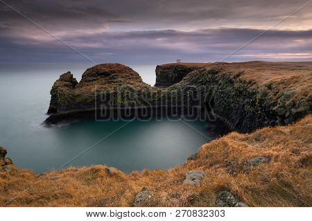 Volcanic Cliffs And Basalt Rocks In Arnarstapi, Iceland