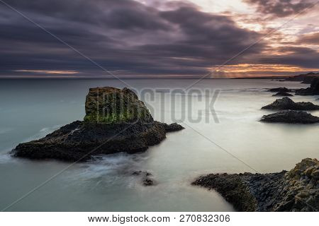 Volcanic Cliffs And Basalt Rocks In Arnarstapi, Iceland