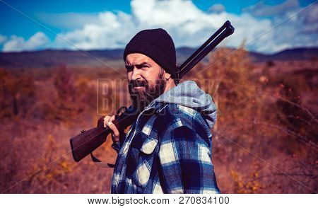 Hunter With Shotgun On Hunt. Hunting. Closed And Open Hunting Season. Hunting Is The Practice Of Kil