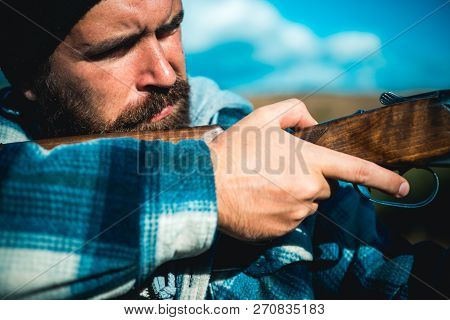 Hunting. Poacher In The Forest. Hunter With Shotgun Gun On Hunt. Hunting Is The Practice Of Killing 