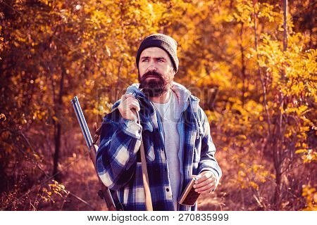 Hunter With Shotgun Gun On Hunt. Autumn Hunting Season. Hunter In The Fall Hunting Season. Autunm Hu