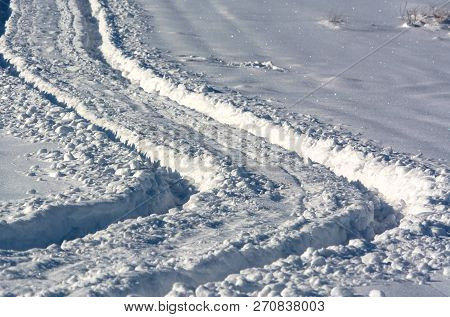 Winding Car Track On The Snow Close-up, Off-road Tire Imprint