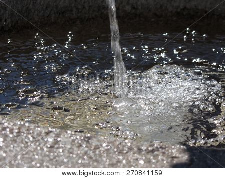 Splash Of Water In A Sunny Day