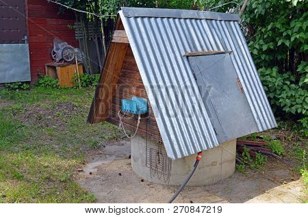 Well With A Tin Roof At The Summer Cottage