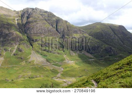 View Of The Famous Glencoe Pass And A82 Road In The Highlands Of Scotland, From High Above, In The S
