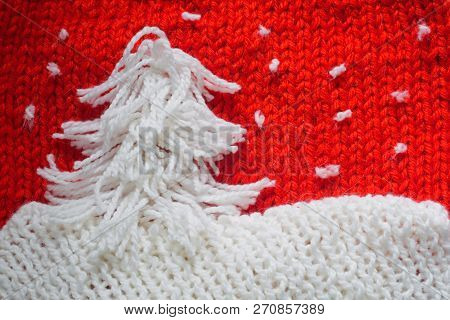 Hadmade Christmas Tree On Red Knitted Woolen Background With Copy Space For Text Christmas Concept
