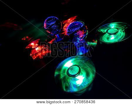 An Abstract Image Featuring Blue Lensballs And Light Painting.