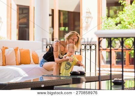 Woman Playing With Her Baby Outside. The Concept Of A Happy Full-fledged Family Life. Games With A C