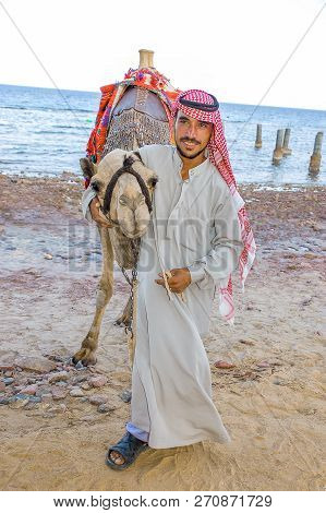 Egyptian With His Camel Posing Against The Sea, June 8, 2008, Taba, Egypt