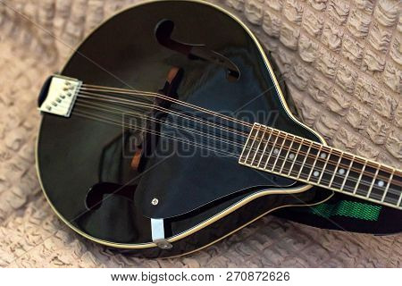 Close Up Of Modeern Black Musical Instrument Mandolin